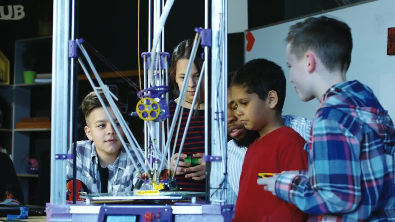 Stock Video Kids Watching A D Printer At School Animated Wallpaper - Free Download