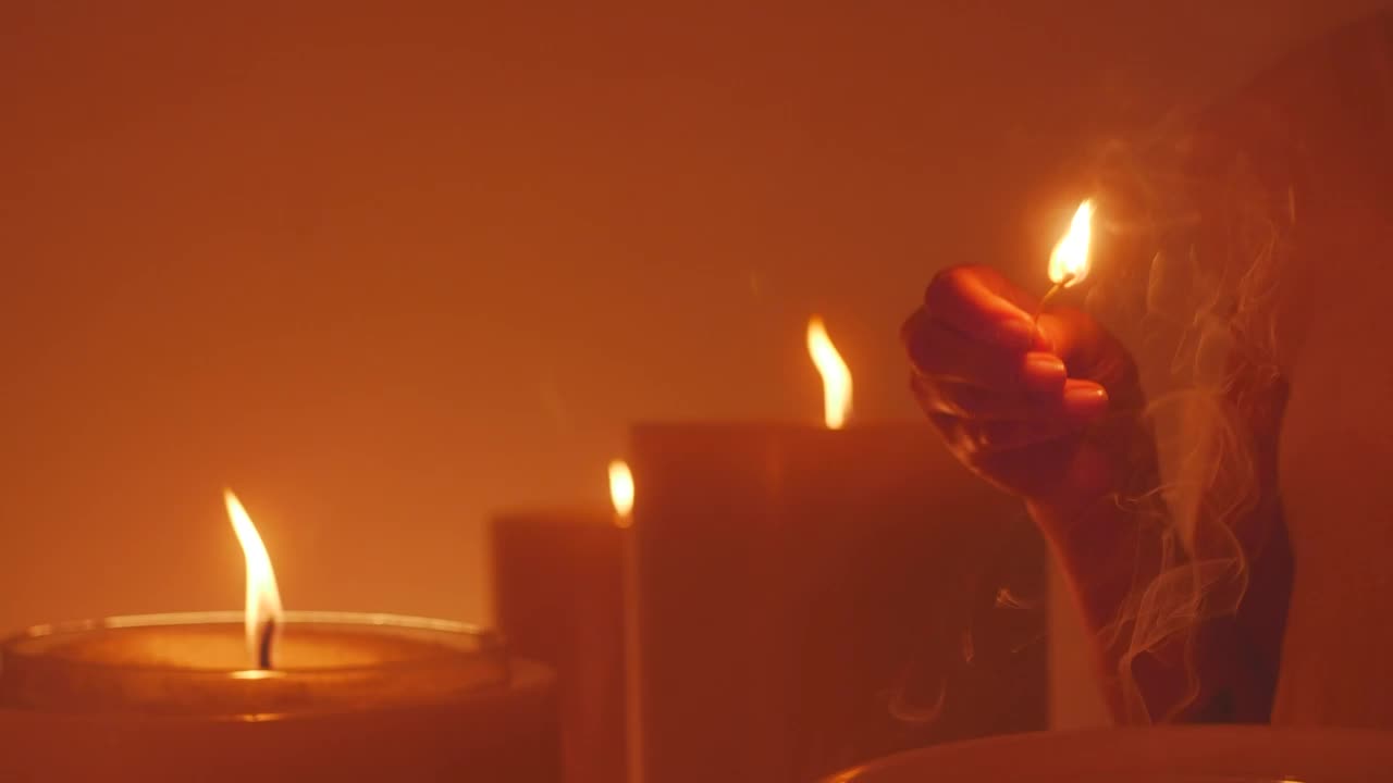 Stock Video Mysterious Woman Lighting A Huge Candle Live Wallpaper - Free Download