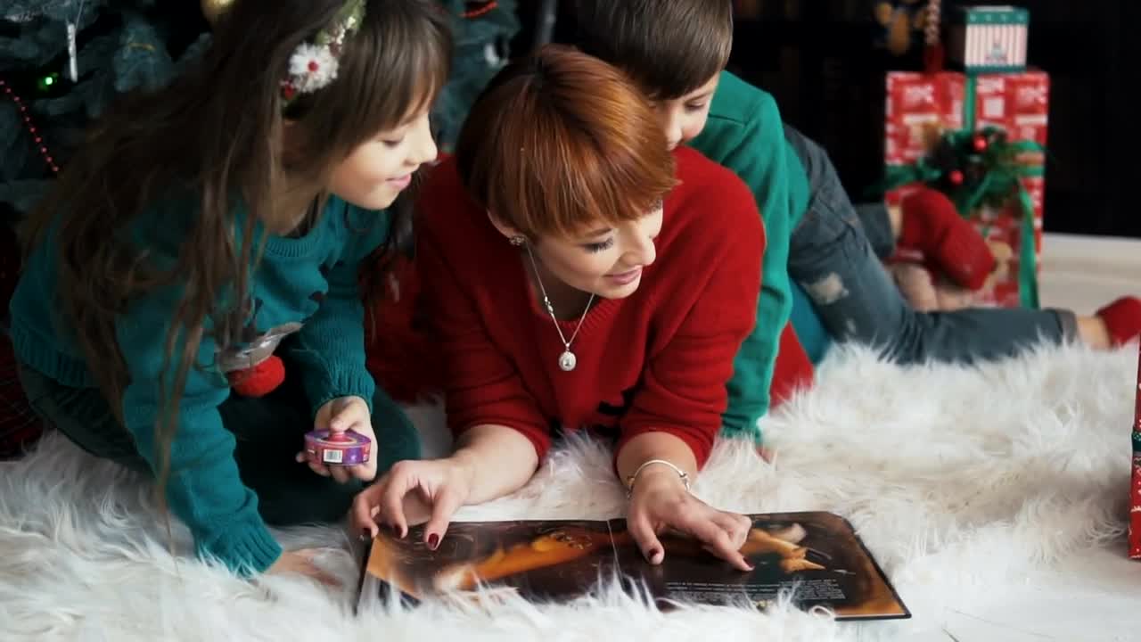 Stock Video Family Celebrates Christmas With Cuddle Near Tree Live Wallpaper For PC - Free Download