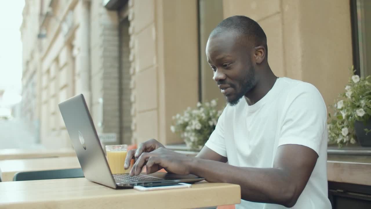 Stock Video Man Gets Emotional While Chatting Online Outside Ith Laptop Animated Wallpaper - Free Download