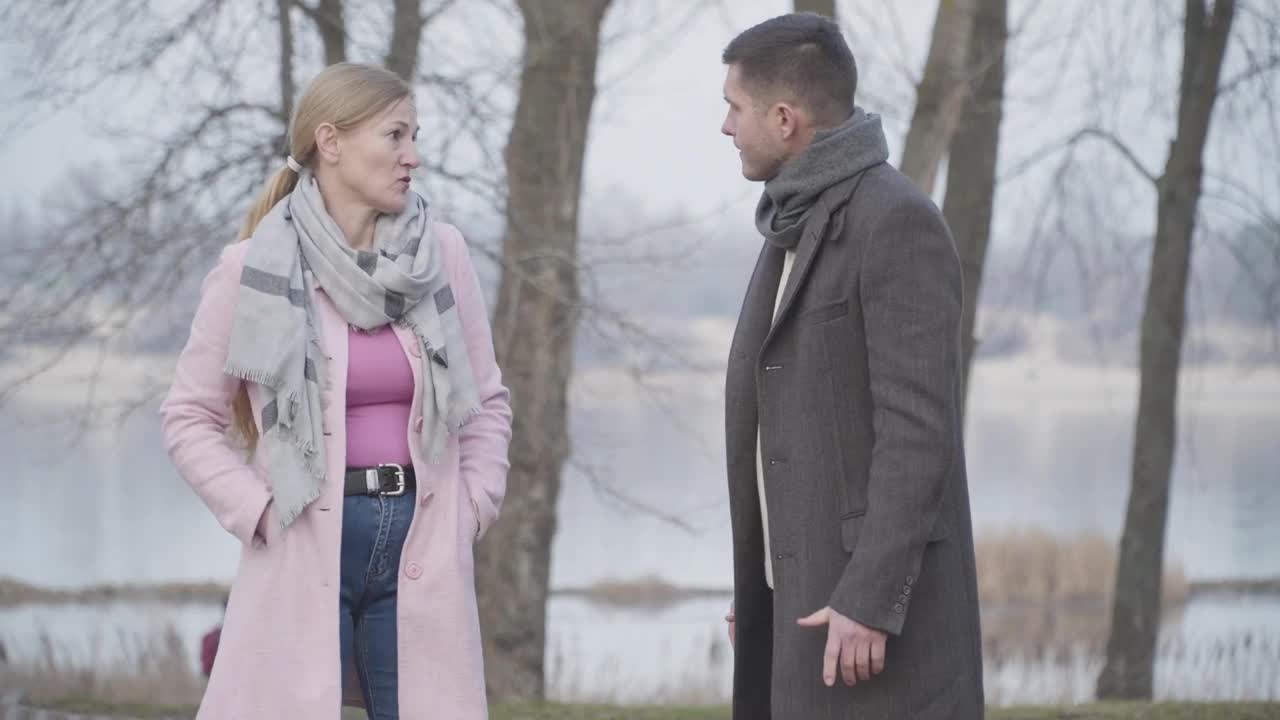 Stock Video Mother And Adult Son Quarrel On Cold Day In Par Animated Wallpaper - Free Download