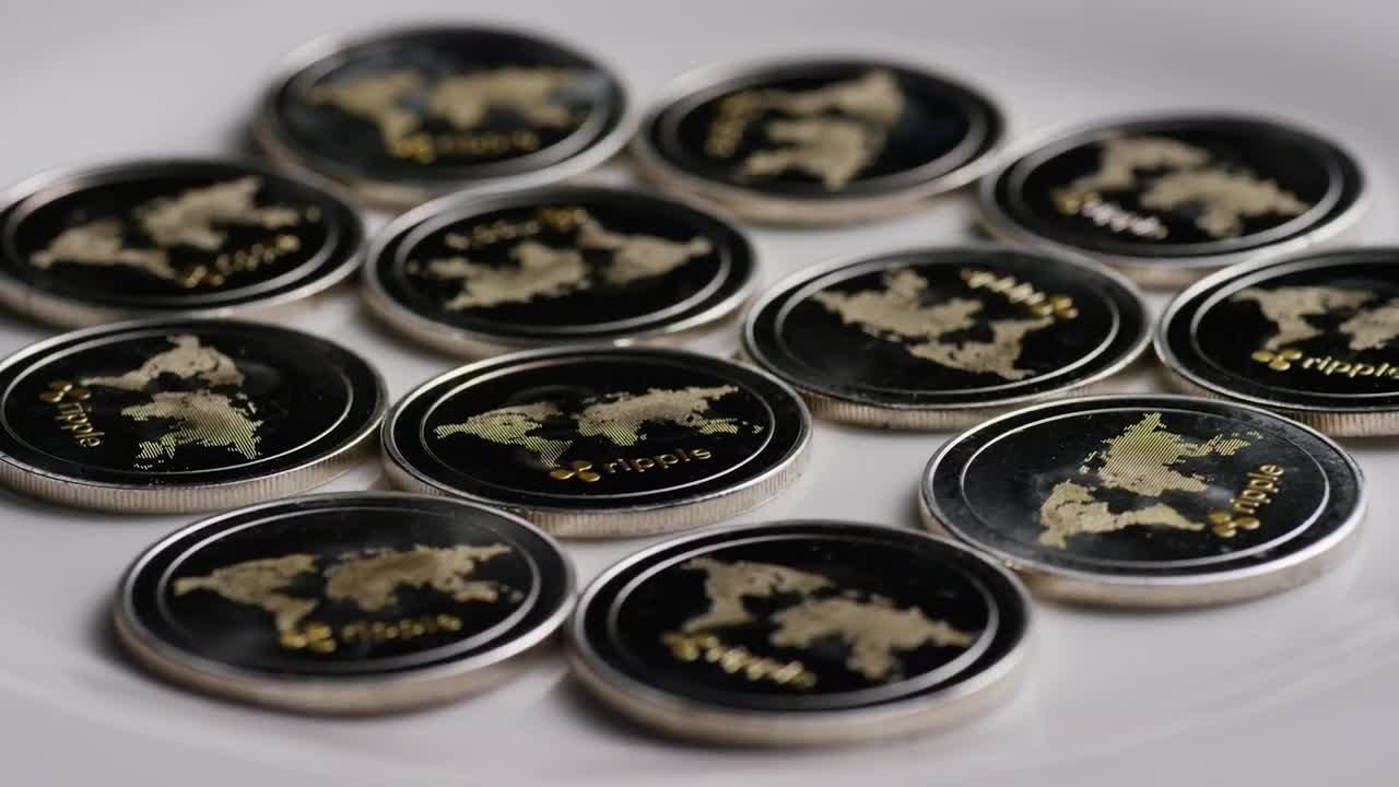 Free Stock Video Ripple Bitcoin Coins Rotating On A White Surface Live Wallpaper - Free Download