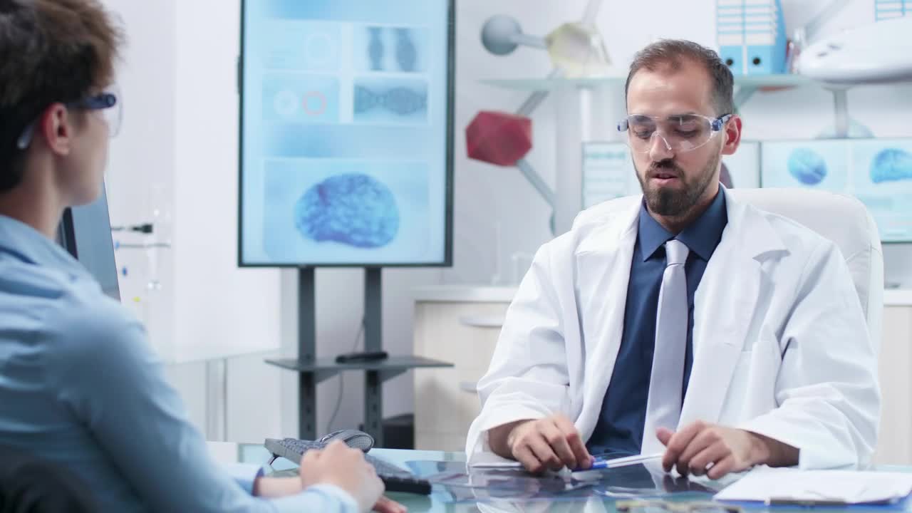 Stock Video Future Scientist Uses Ar Glasses In Meeting With Colleague Live Wallpaper For PC - Free Download