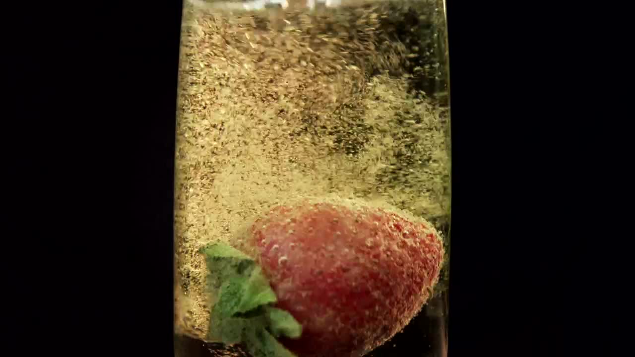 Stock Video Dropping A Strawberry In Champagne Live Wallpaper For PC - Free Download