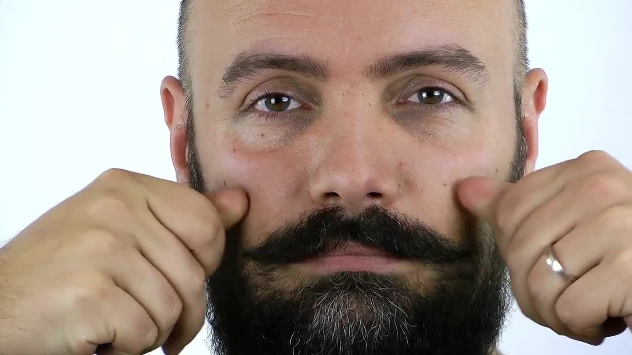 Stock Video Man Combing His Mustache Animated Wallpaper - Free Download