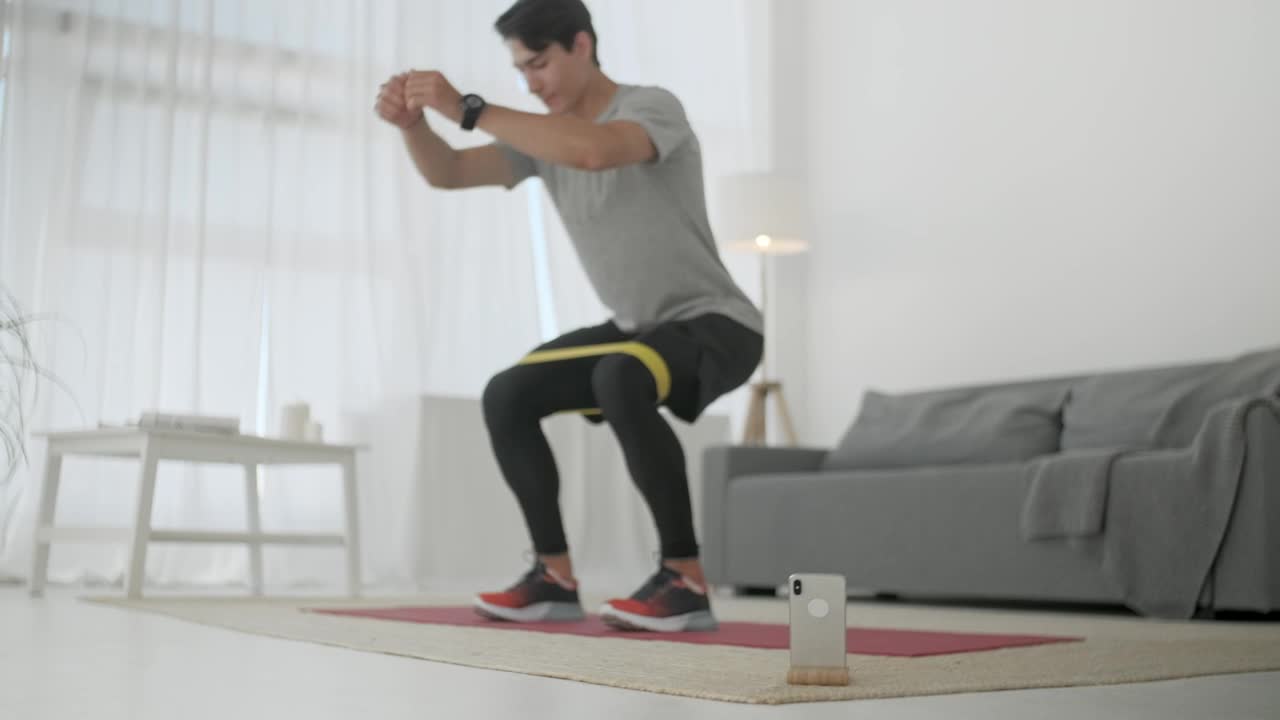 Stock Video Man Doing Squats At Home Animated Wallpaper - Free Download