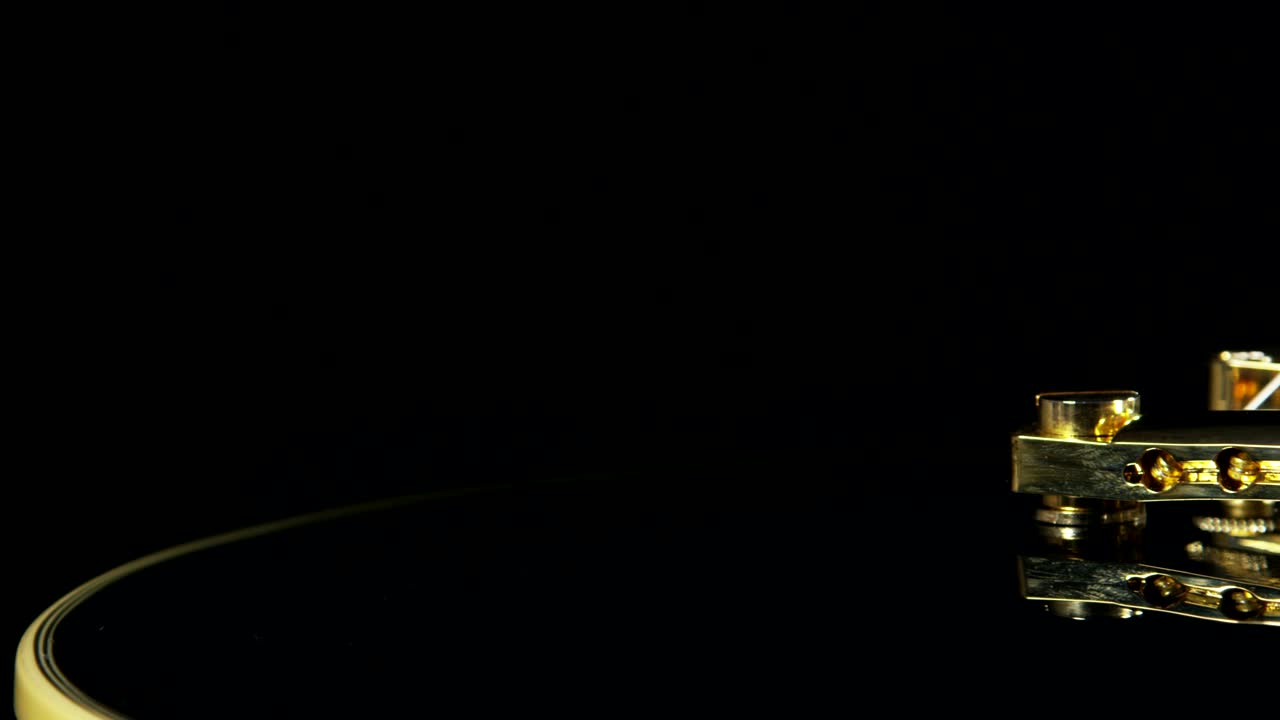 Stock Video Golden Guitar Strings Against A Dark Room Live Wallpaper For PC - Free Download