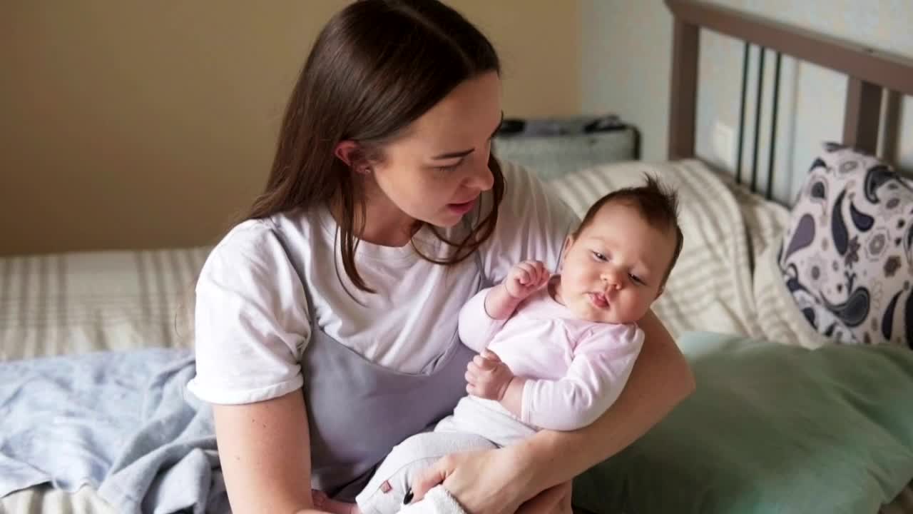 Stock Video Mother Holding Her Baby In Her Arm Animated Wallpaper - Free Download
