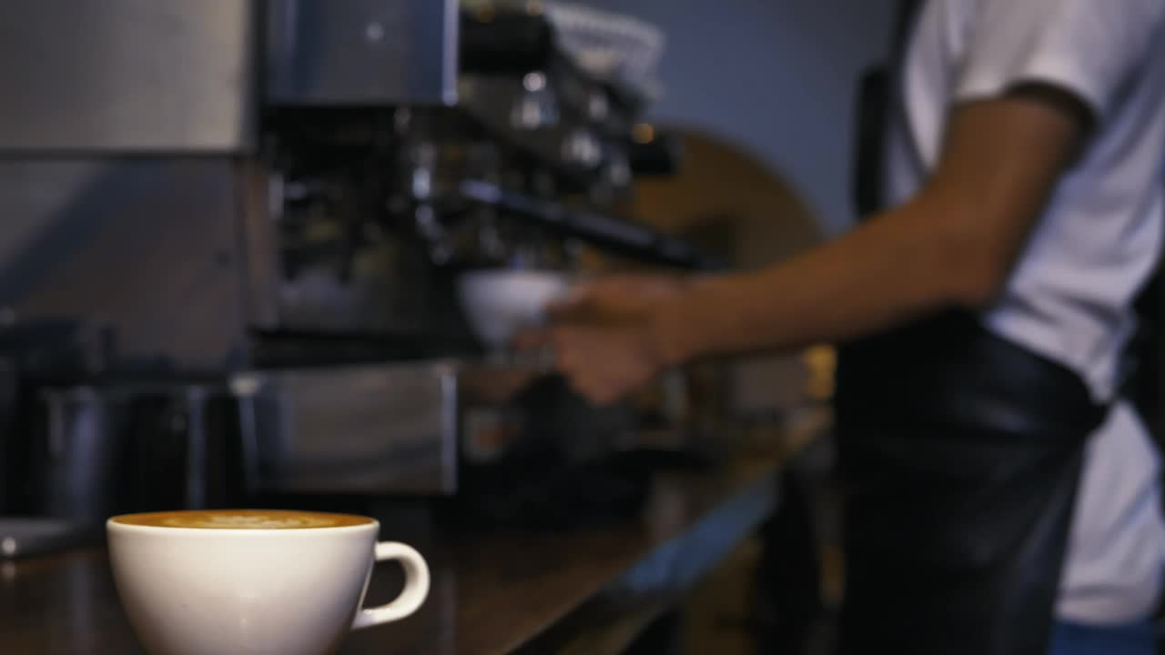 Stock Video Employee Serving A Cup Of Coffee From A Machine Live Wallpaper For PC - Free Download