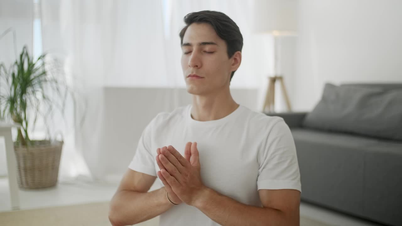 Free Stock Video Young Man Meditating In The Living Room Live Wallpaper - Free Download