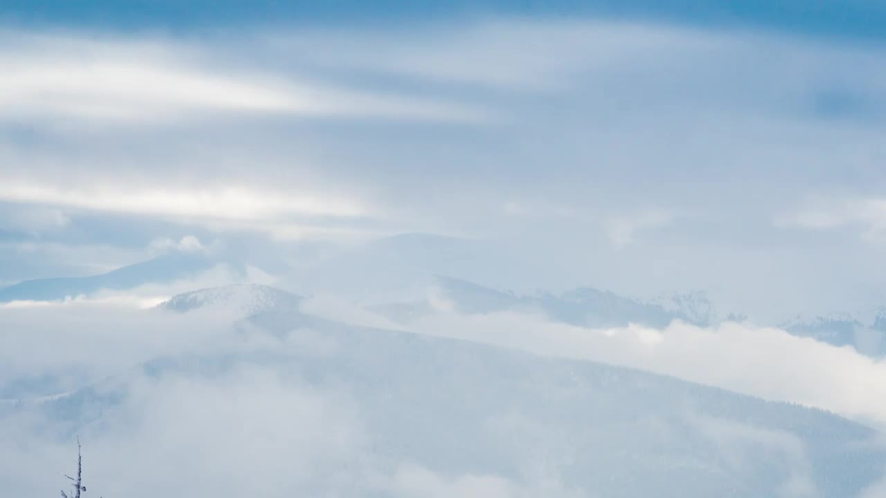 Free Video Stock tilt shot in a foggy winter mountains Live Wallpaper - Free Download