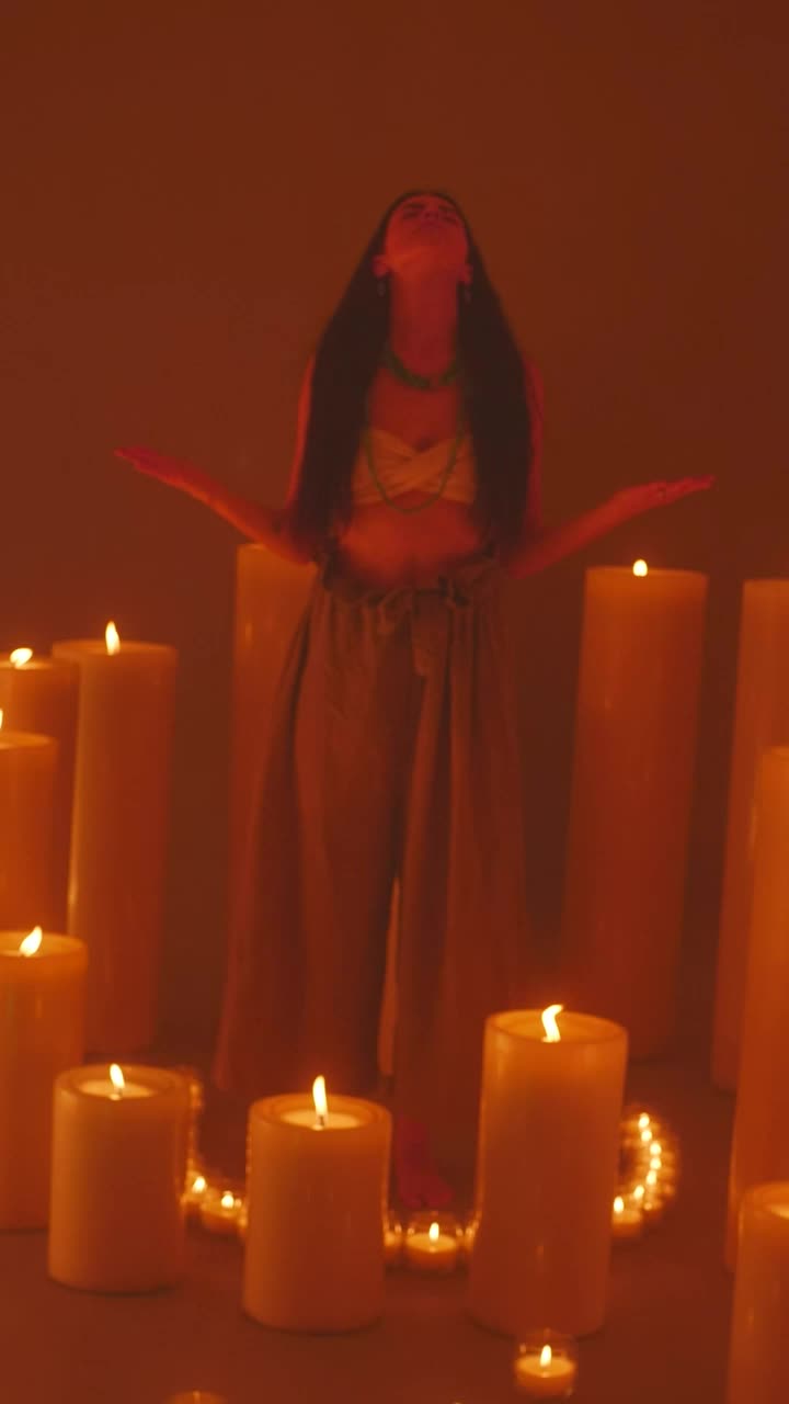 Free Video Stock Spiritual Girl Meditating Among Many Burning Candles Live Wallpaper - Free Download