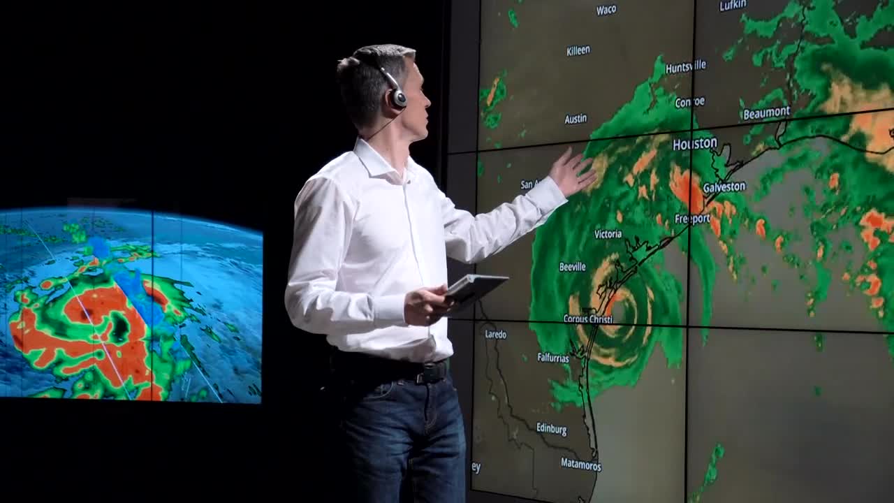 Stock Footage Weatherman Showing A Hurricane On The Screen Live Wallpaper - Free Download