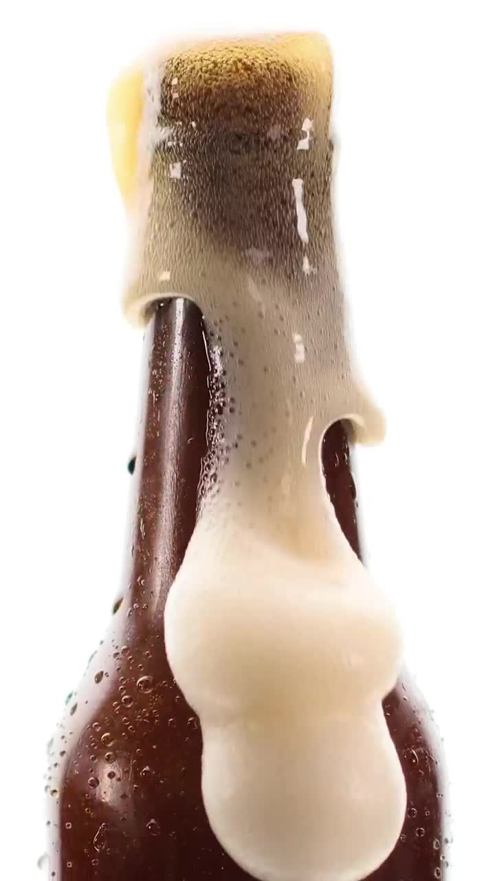 Stock Video Beer Bottle Spilling Foam On A White Background Live Wallpaper For PC - Free Download