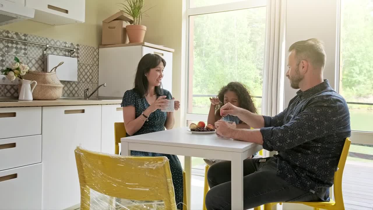 Stock Video Diverse Race Family Sit At Kitchen Table Drinking Coffee Live Wallpaper For PC - Free Download