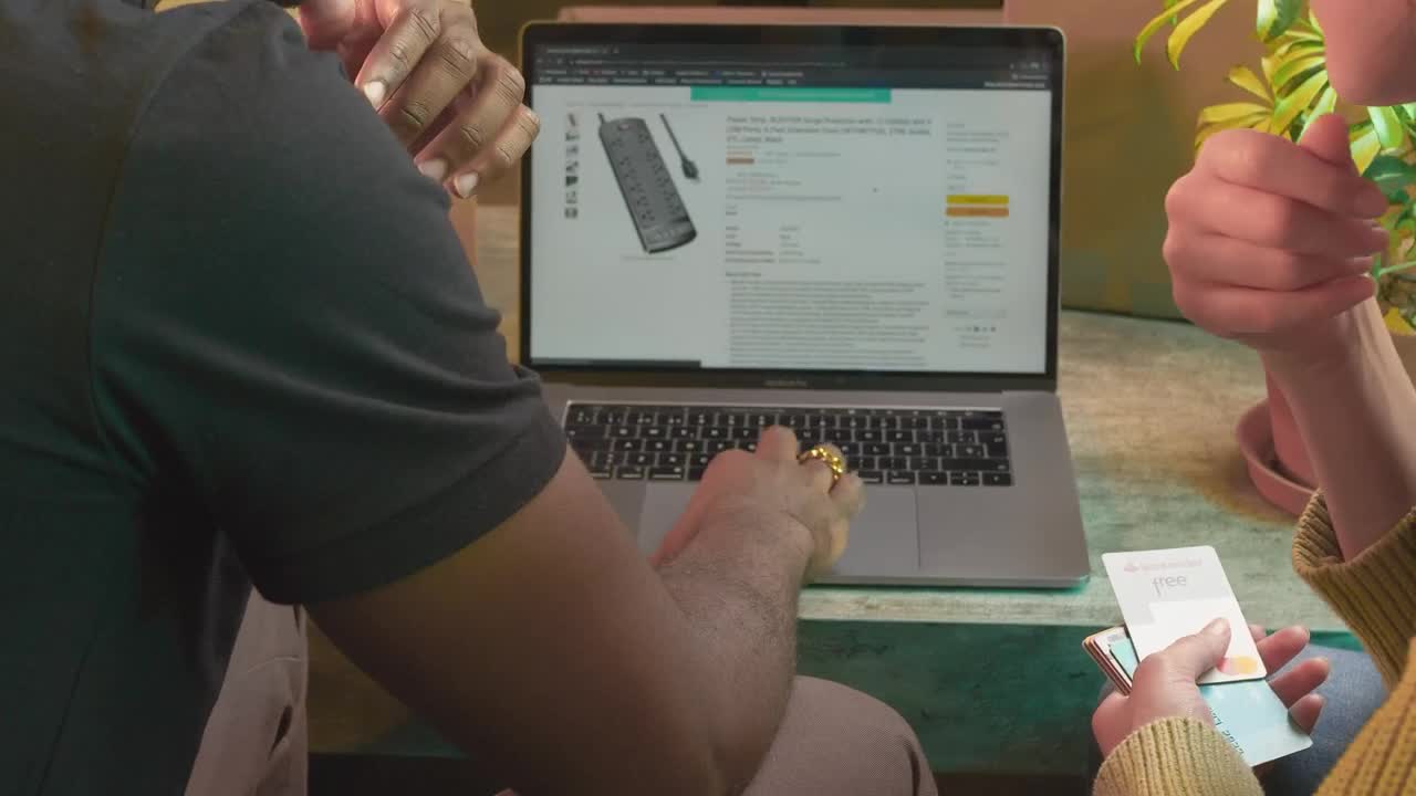 Stock Video Man And Woman Buying Online On A Laptop Animated Wallpaper - Free Download