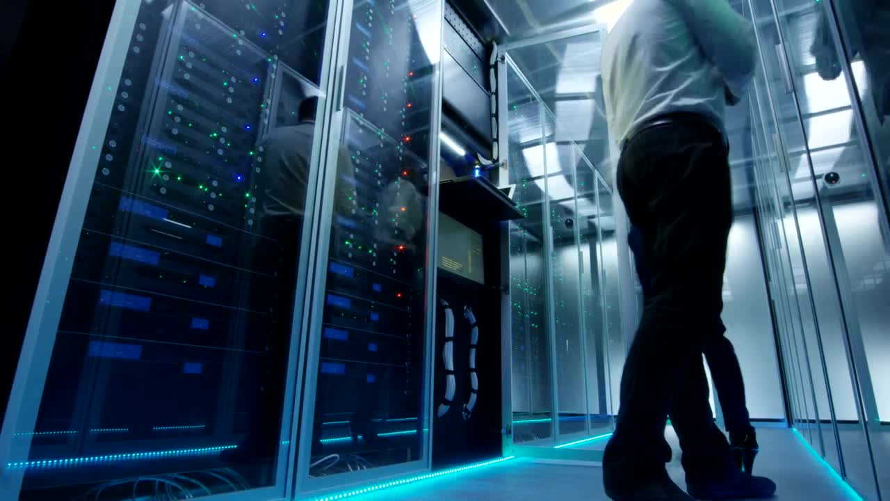 Free Video Stock time lapse of engineers working in a data center Live Wallpaper - Free Download