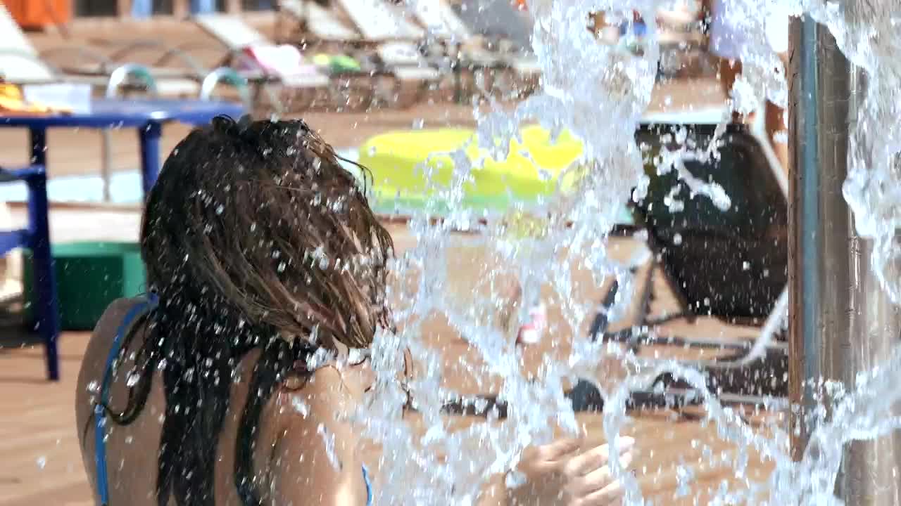 Stock Video Beautiful Girl In Bikini Splashed With Water At Resort Live Wallpaper For PC - Free Download
