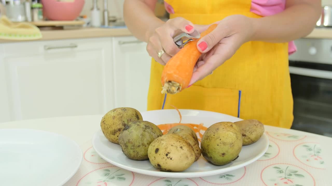 Stock Video Peeling A Carrot In The Kitchen Live Wallpaper - Free Download
