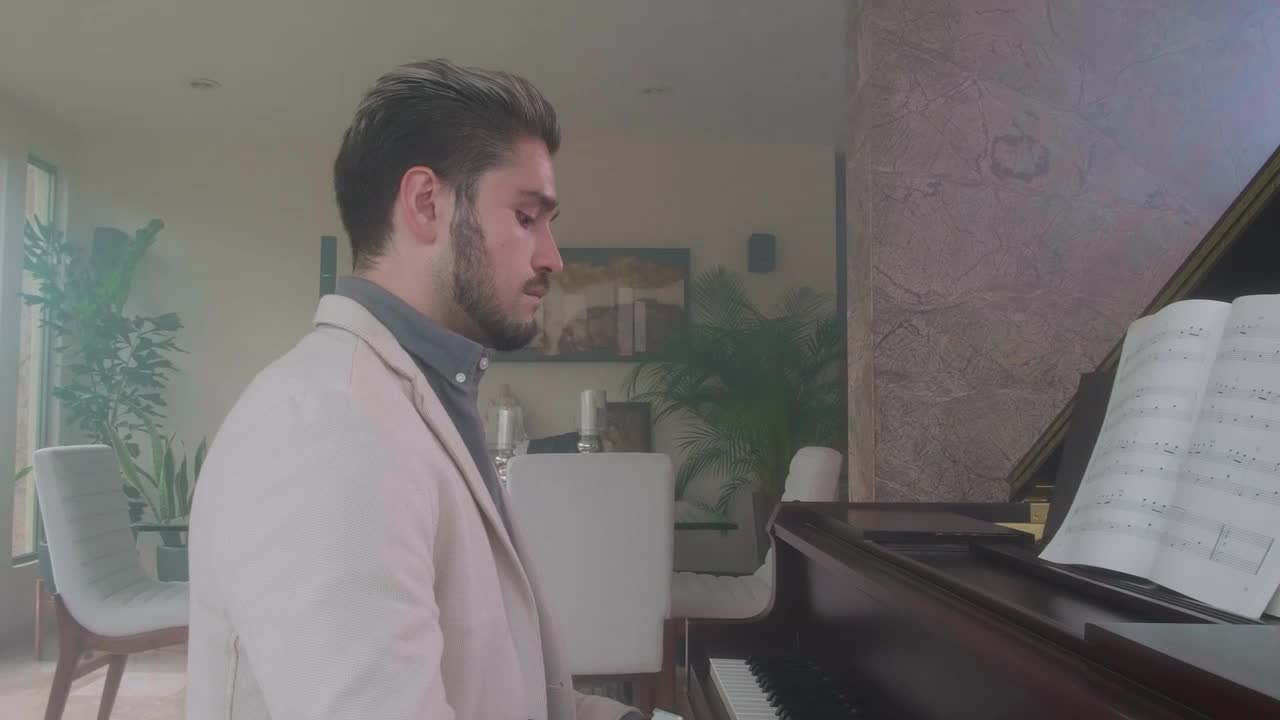 Stock Video Elegant Man Playing The Piano In A Luxurious Home Live Wallpaper For PC - Free Download