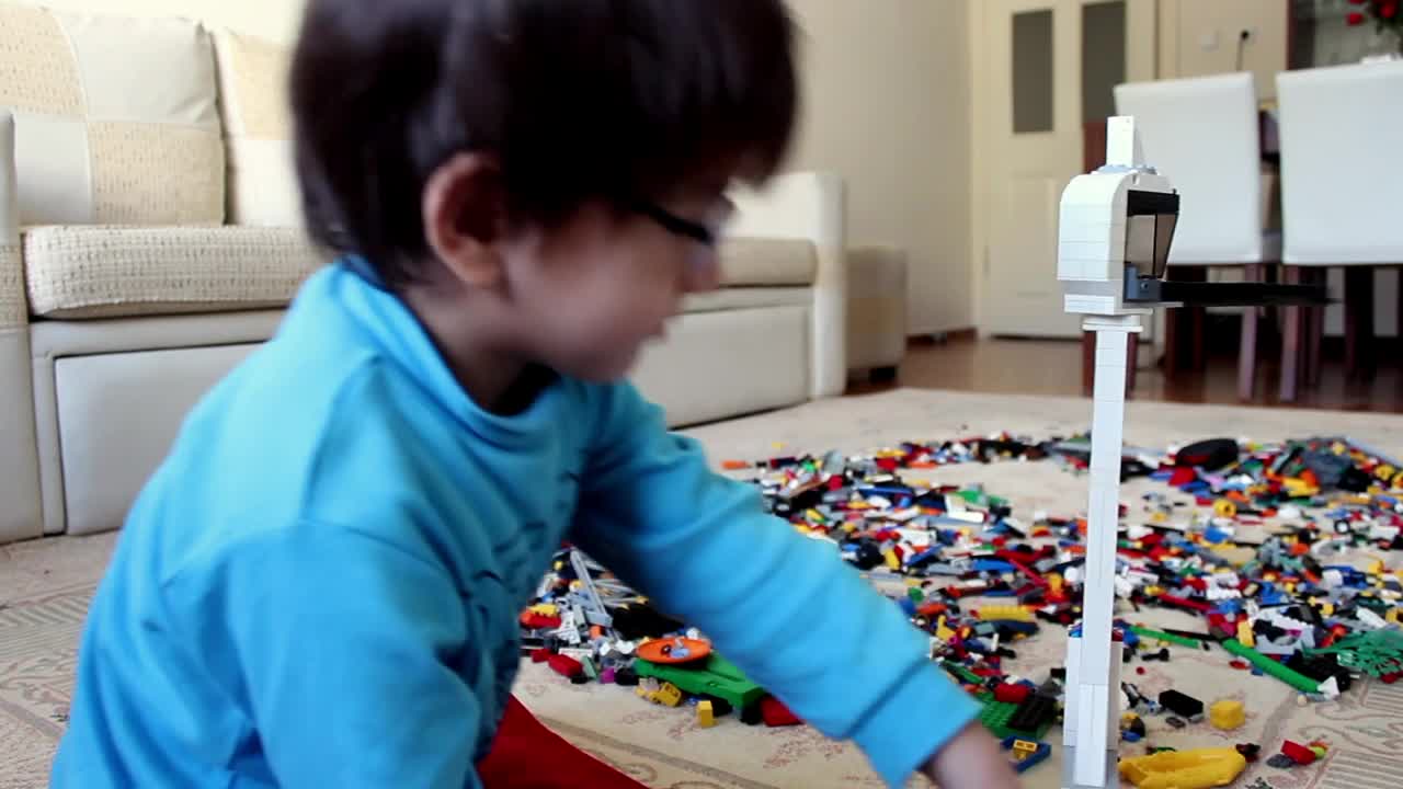 Stock Video Little Boy Playing With Many Lego Cubes Animated Wallpaper - Free Download