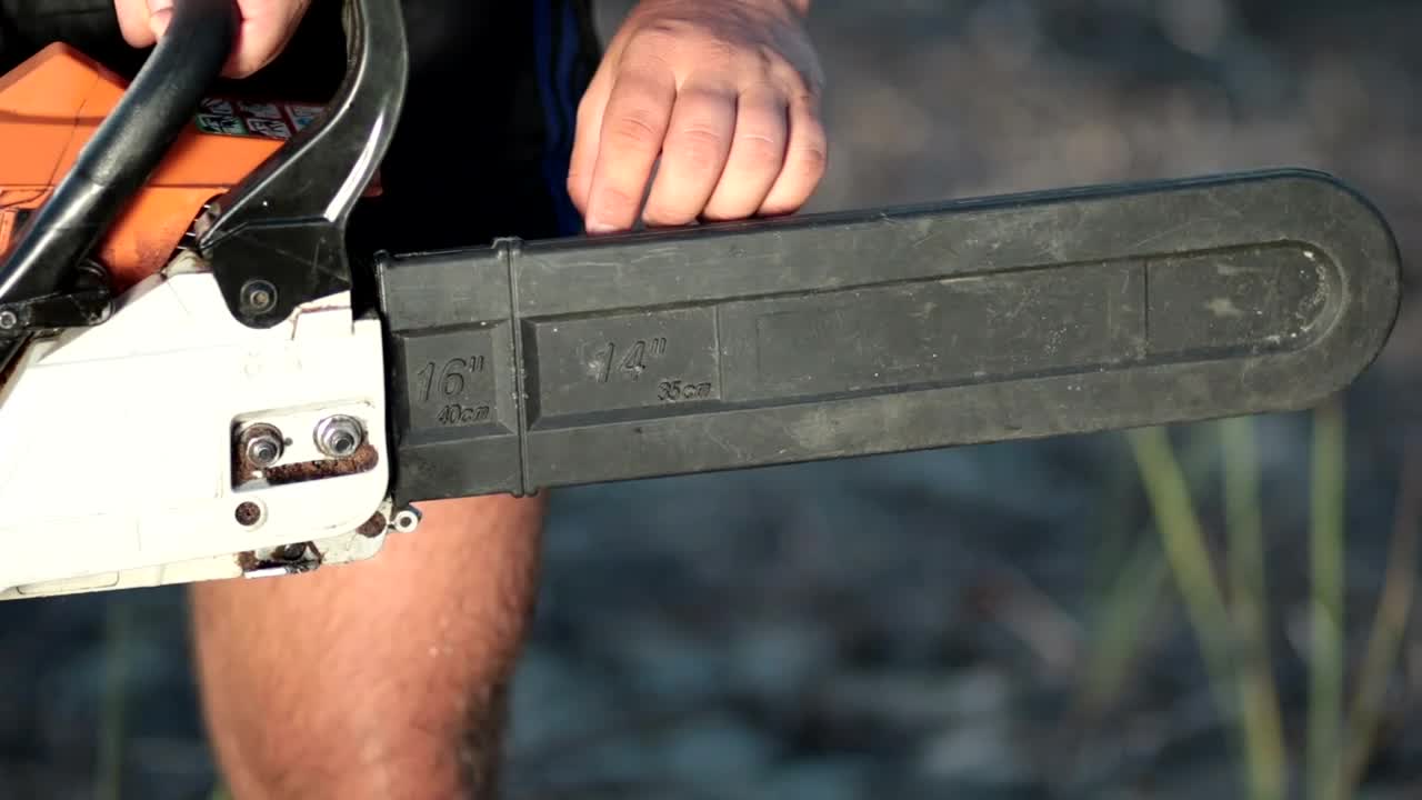 Stock Video Man Removing The Holster From A Chainsa Animated Wallpaper - Free Download