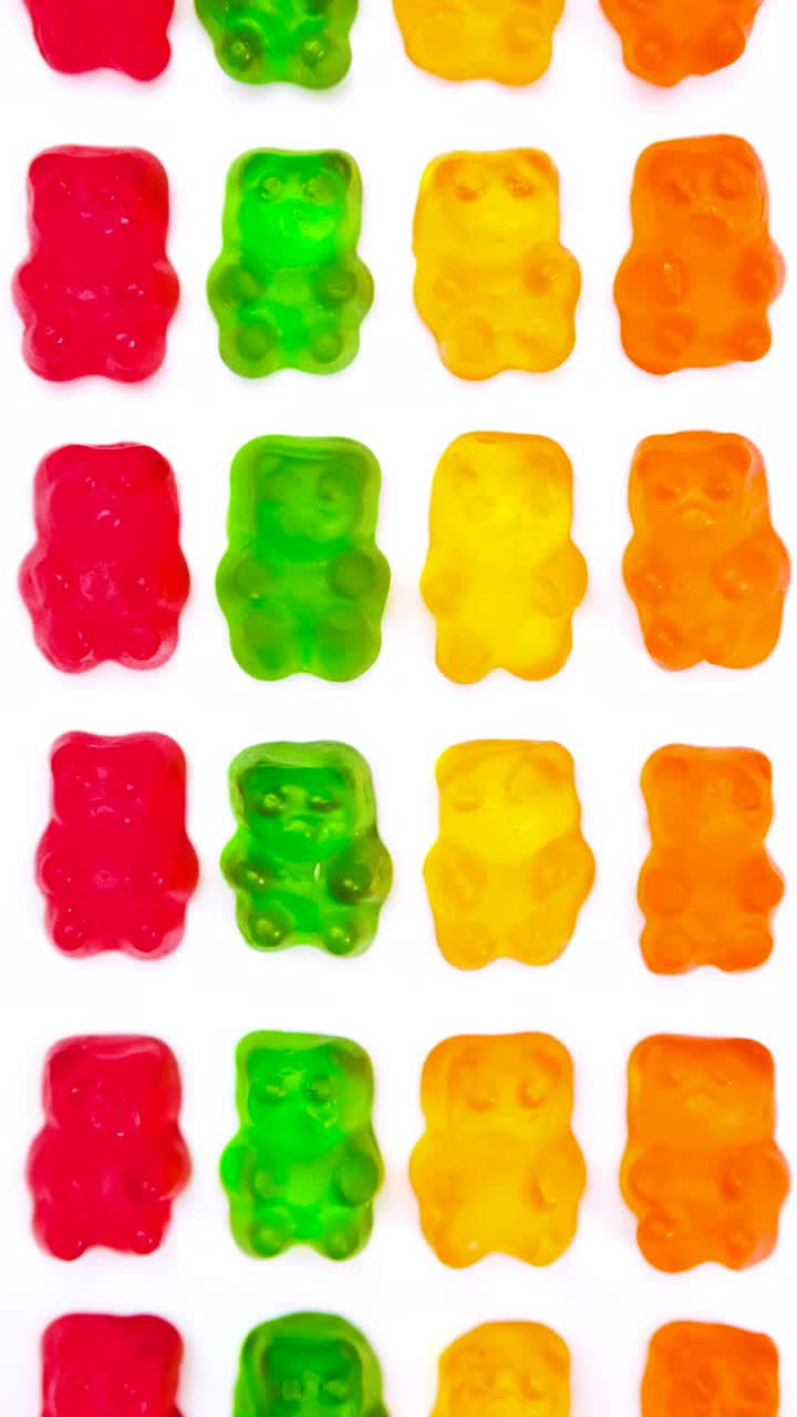Stock Video Gummy Bears Lined Up On A White Background Live Wallpaper For PC - Free Download