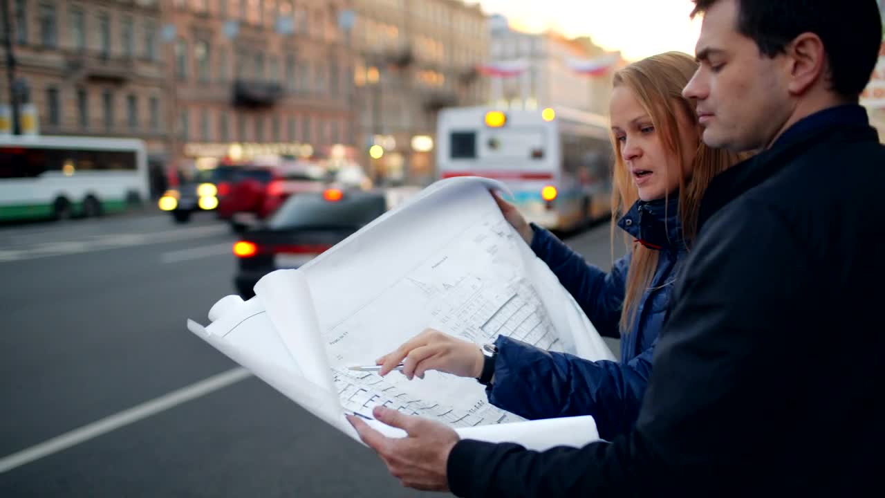Free Stock Video Reviewing Building Plans In The Street Live Wallpaper - Free Download