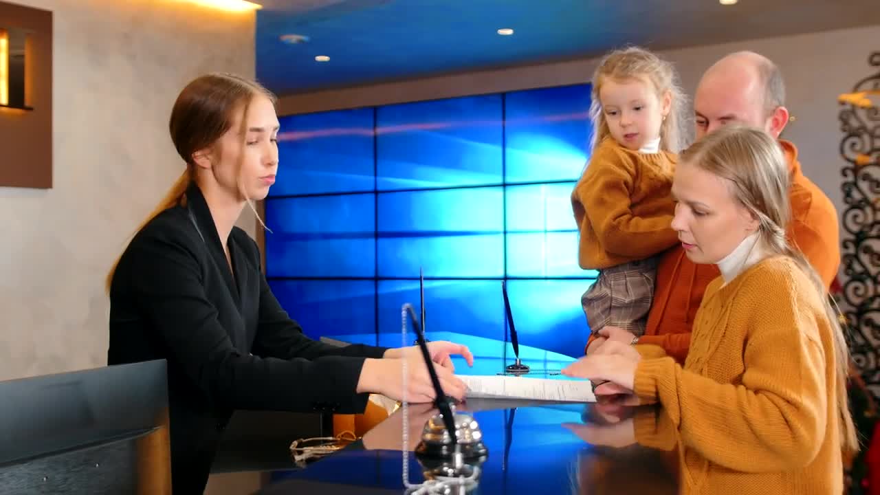 Stock Video Family At A Hotel Reception Checking In Live Wallpaper For PC - Free Download