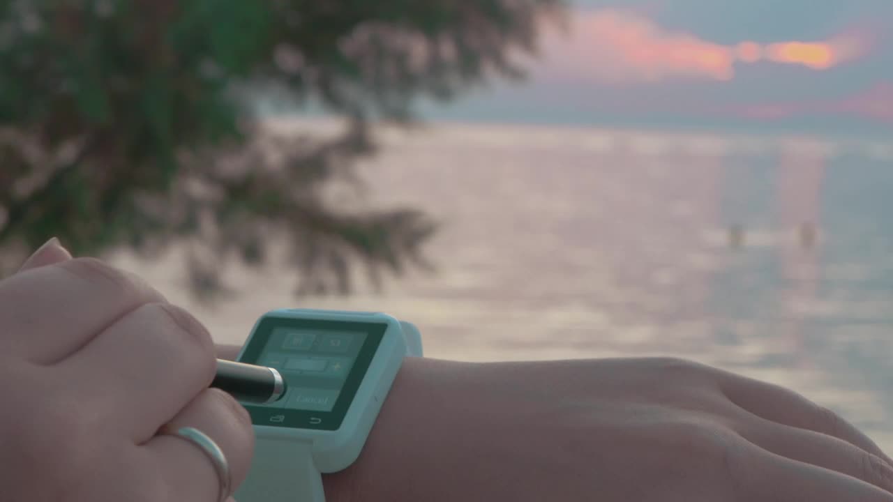 Free Stock Video Setting Up A Smartwatch At The Beach Live Wallpaper - Free Download