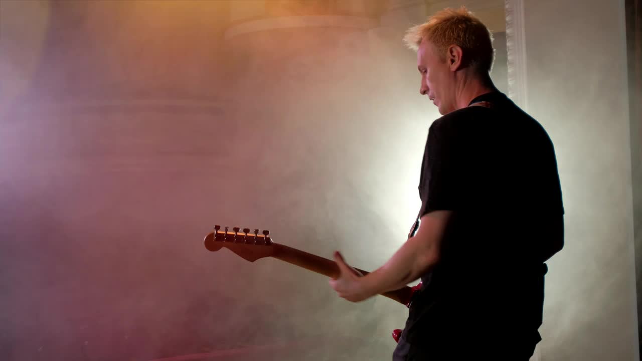 Stock Video Guitarist Playing Guitar On A Smoky Stage Live Wallpaper For PC - Free Download