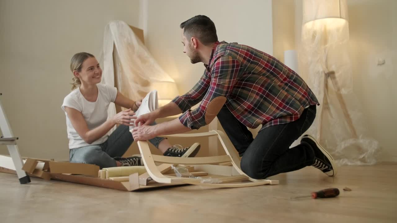 Stock Video Couple Look At Instructions While Assembling Furniture Live Wallpaper For PC - Free Download