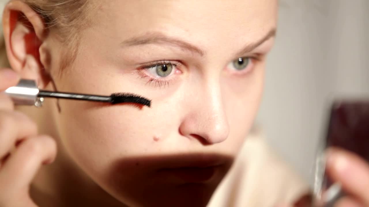 Stock Footage Woman Applying Makeup To Her Eyes Live Wallpaper - Free Download