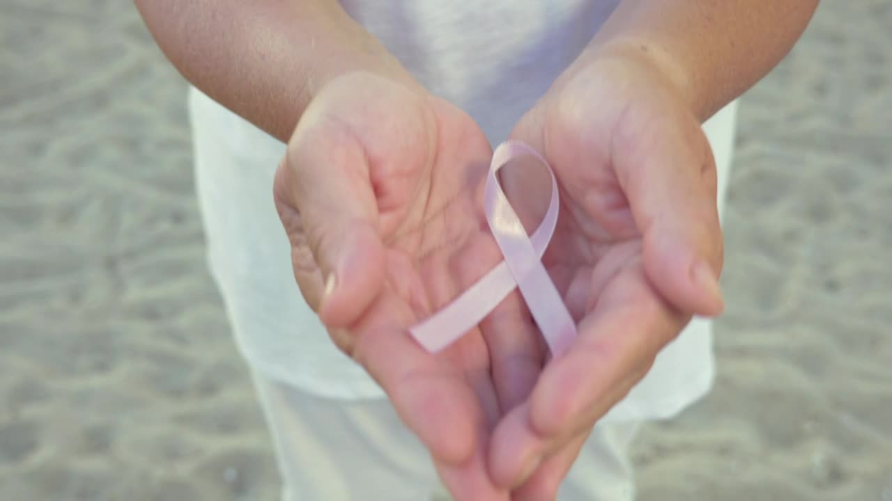 Stock Video Holding The Pink Cancer Ribbon Animated Wallpaper - Free Download