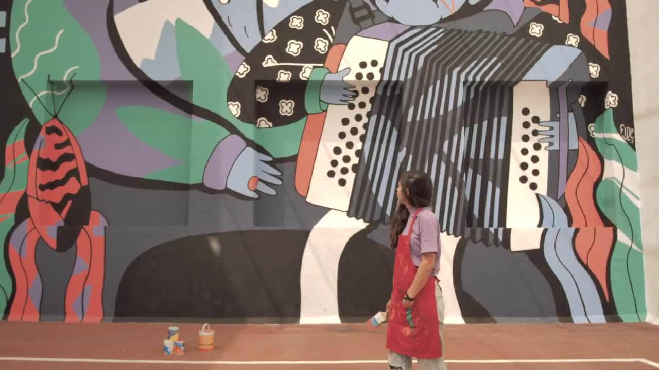 Stock Video Paint Covered Woman Stands In Front Of Mural Live Wallpaper - Free Download