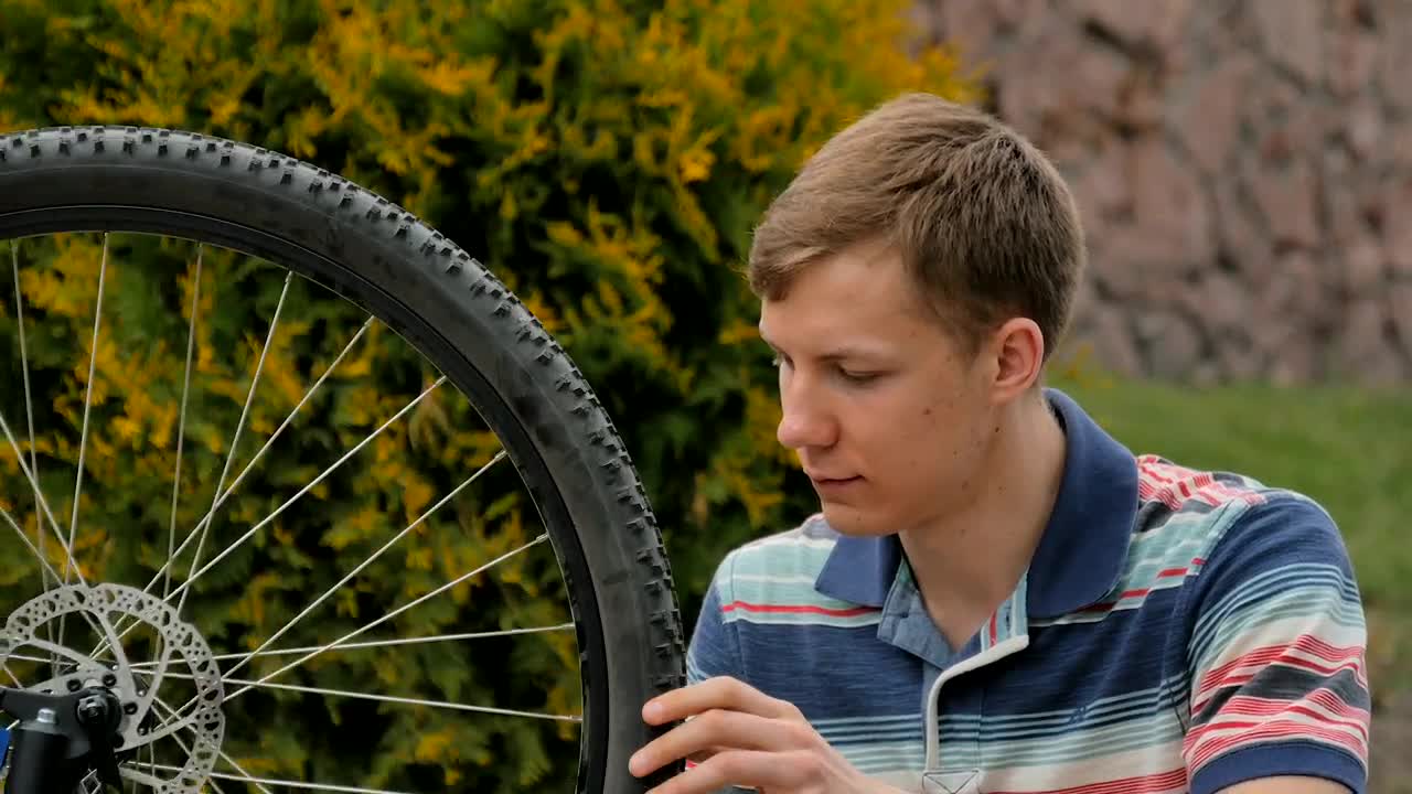 Stock Video Bike Repair Man Spins Wheel And Gives Ok Live Wallpaper For PC - Free Download