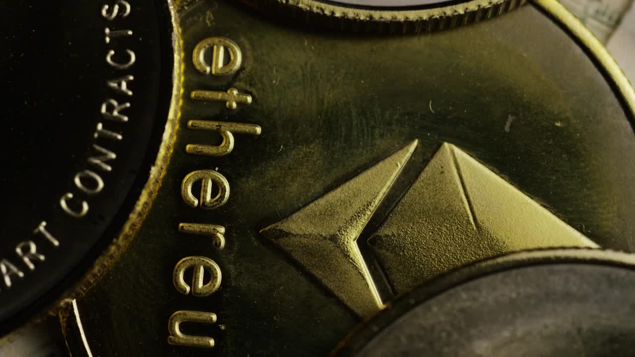 Stock Video Macro Shot Of Ethereum Golden Coins Animated Wallpaper - Free Download