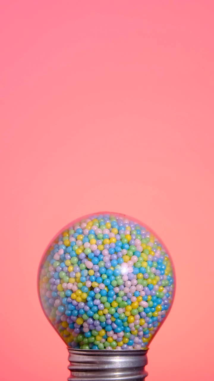 Free Stock Video Round Spotlight That Glows Full Of Colorful Candies On A Live Wallpaper - Free Download