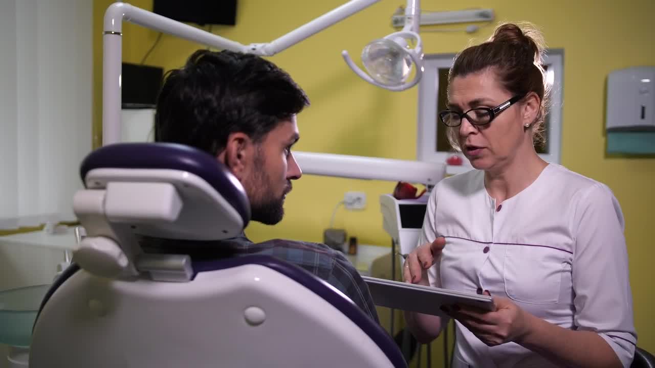 Stock Video Dentist Using A Tablet While Speaking Live Wallpaper For PC - Free Download