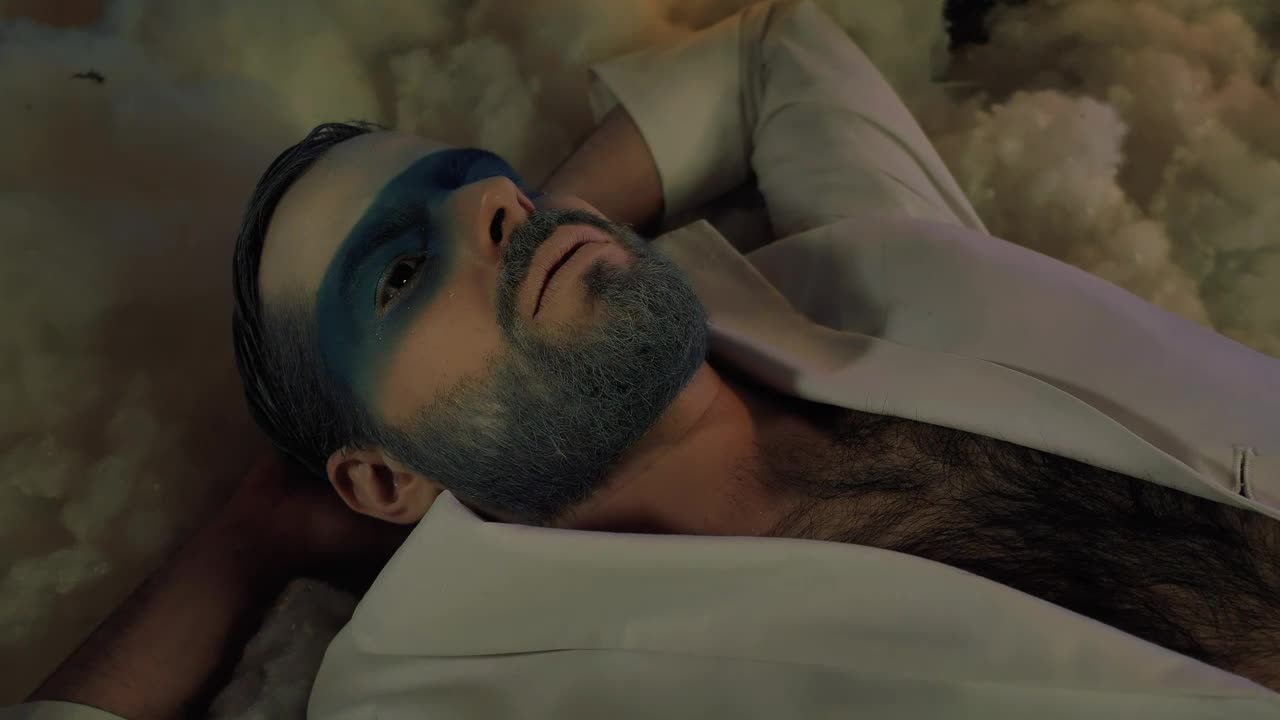 Stock Video Man Lying Down Cold Toned Makeup On Christma Animated Wallpaper - Free Download