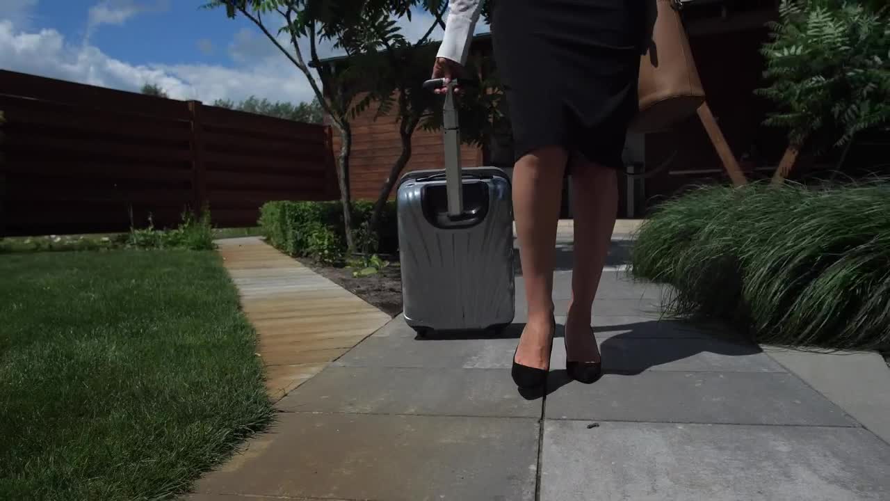 Stock Video Lawyer Walking With Her Suitcase Animated Wallpaper - Free Download
