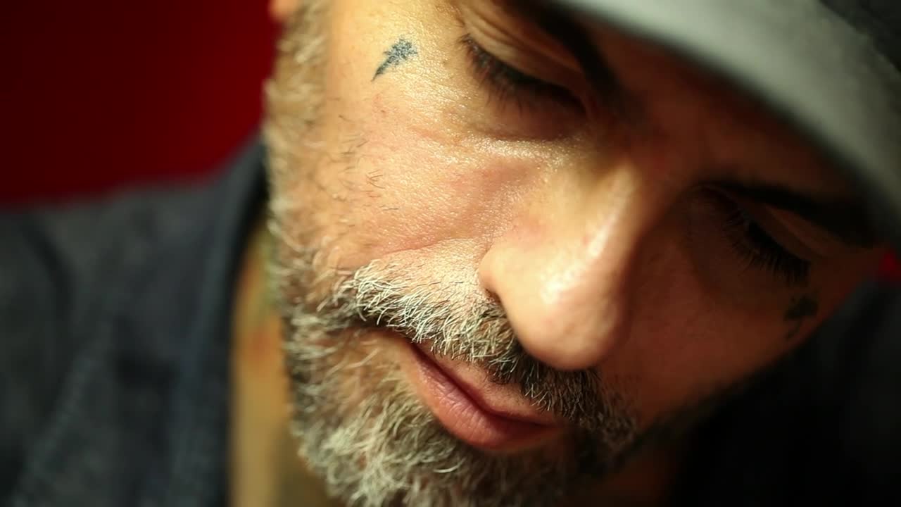 Free Video Stock tattoo artist doing a tattoo to a client Live Wallpaper - Free Download