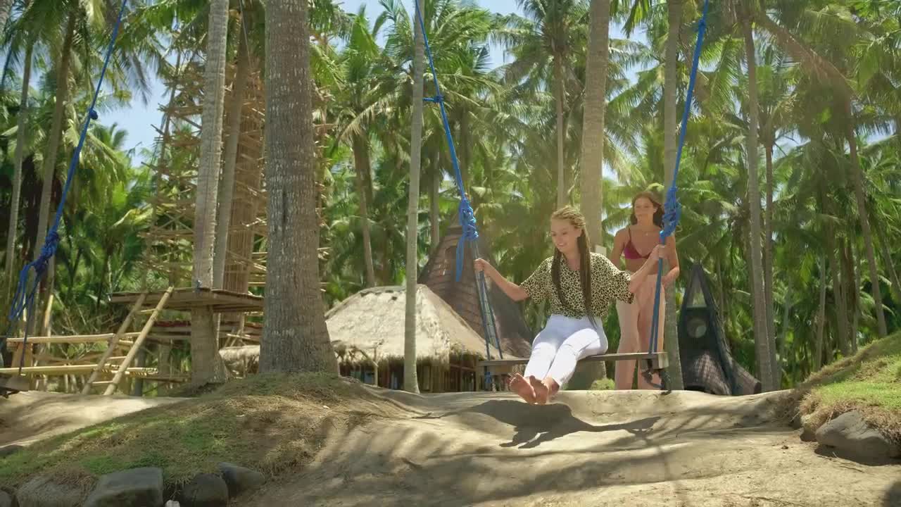 Free Stock Video Woman Swinging Her Friend On The Beach Live Wallpaper - Free Download