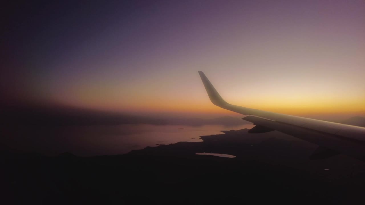 Stock Video Panorama From The Window Of An Airplane At Dusk Live Wallpaper - Free Download