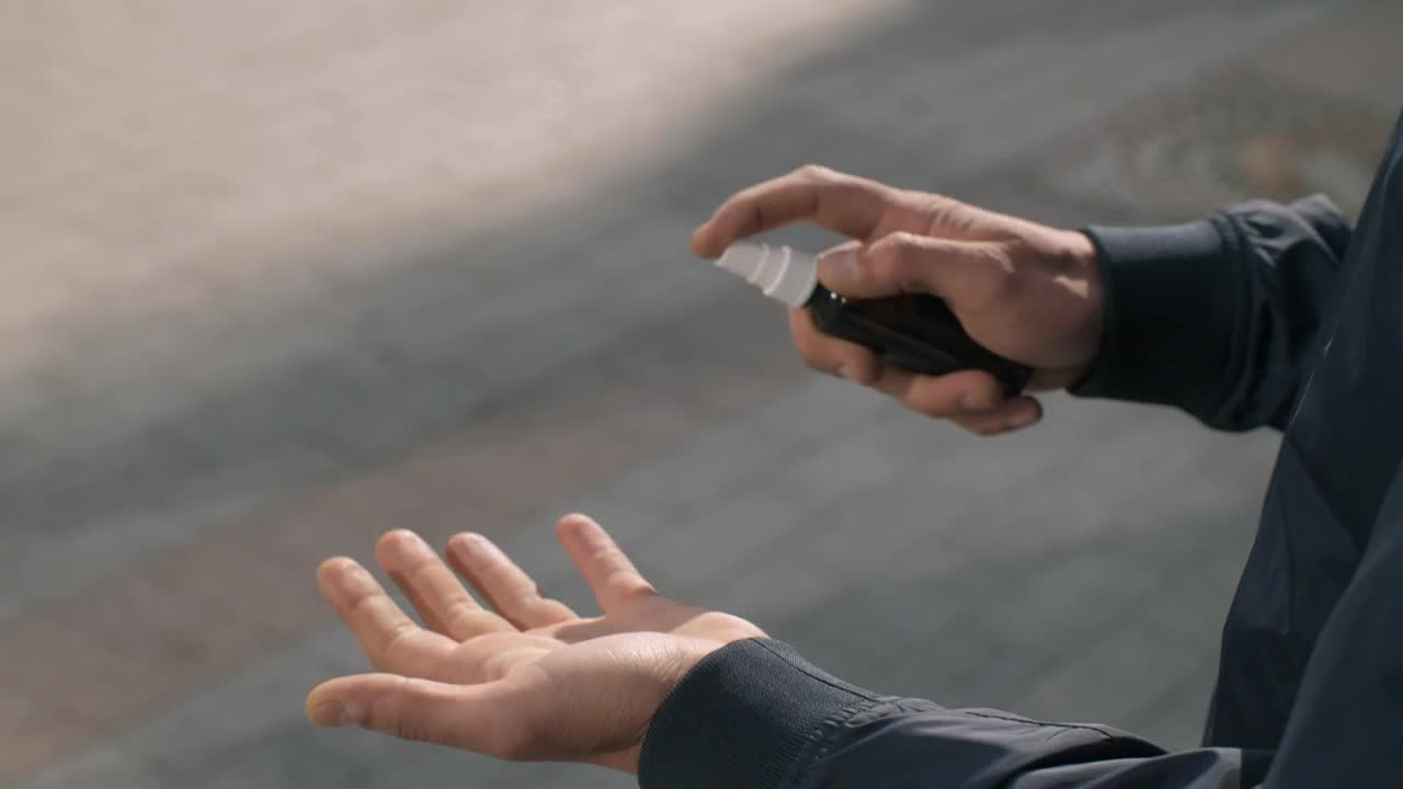 Video Stock Person Sanitizing His Hands With A Spray Live Wallpaper Free - Free Download