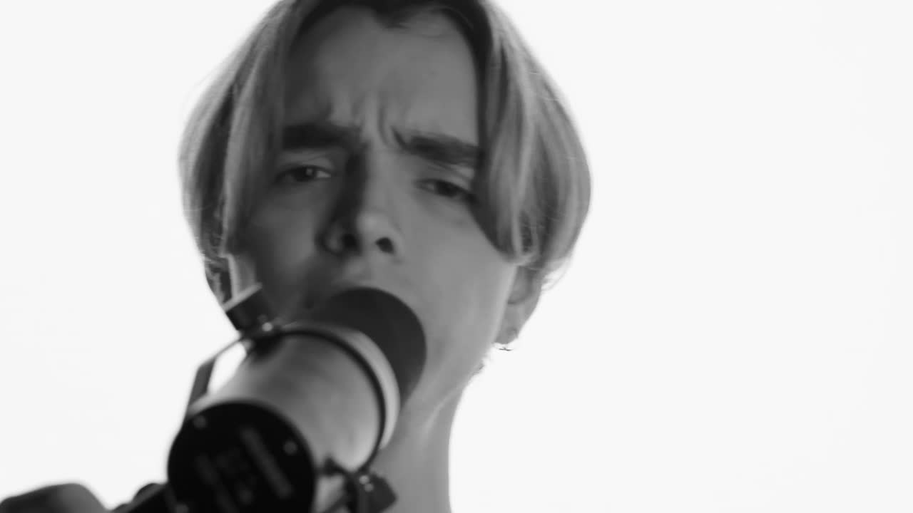 Stock Video Face Of A Man Singing In Front Of A Microphone Live Wallpaper For PC - Free Download