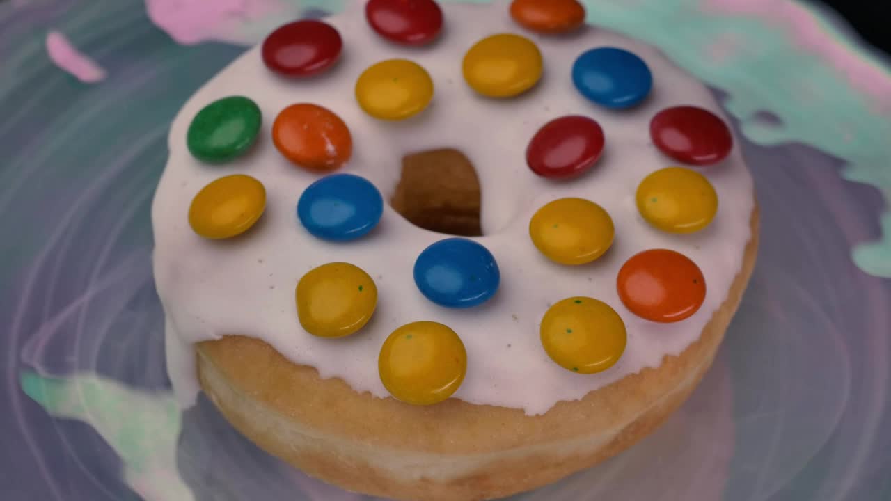Stock Video Donut With White Frosting And Colored Chocolates Live Wallpaper For PC - Free Download