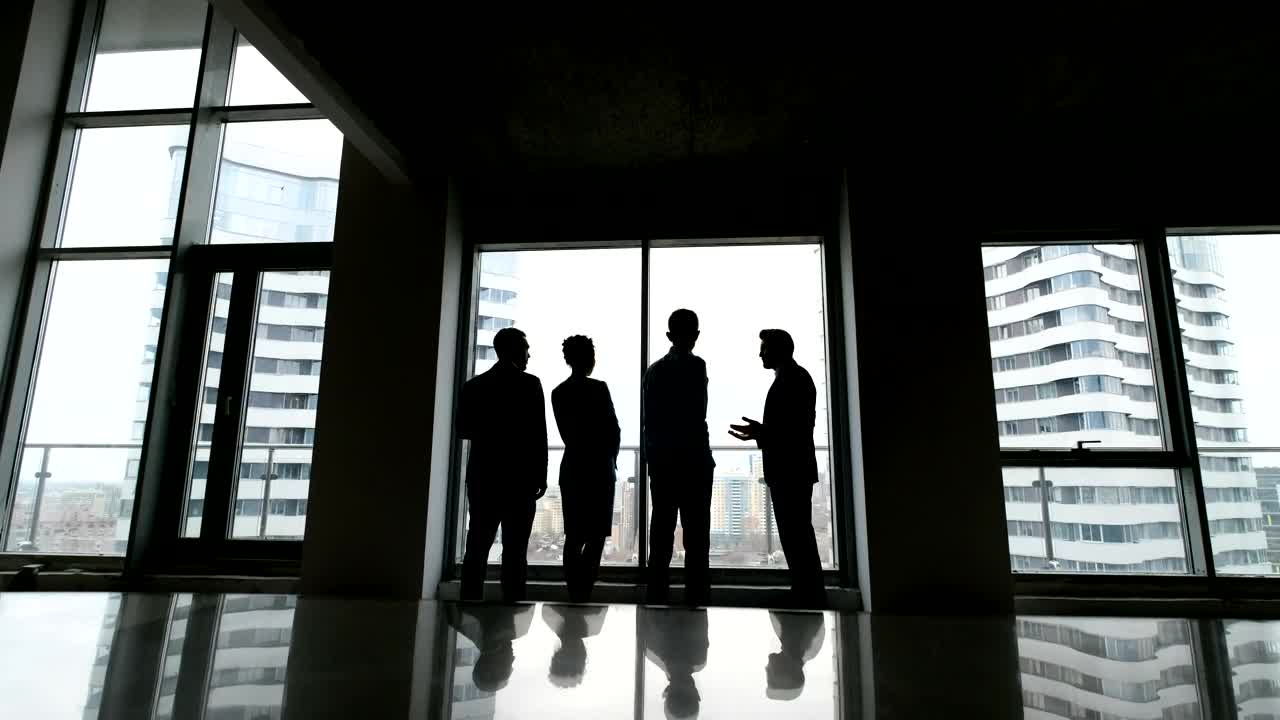 Free Stock Video Silhouette Of Business People Talking By Highrise Window Live Wallpaper - Free Download