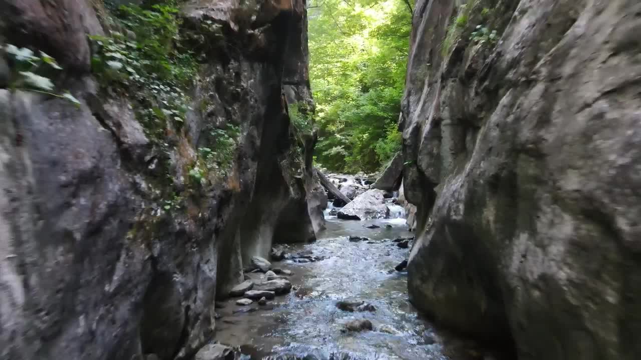 Stock Video Man Hiking In A Stream Between Rocks Animated Wallpaper - Free Download