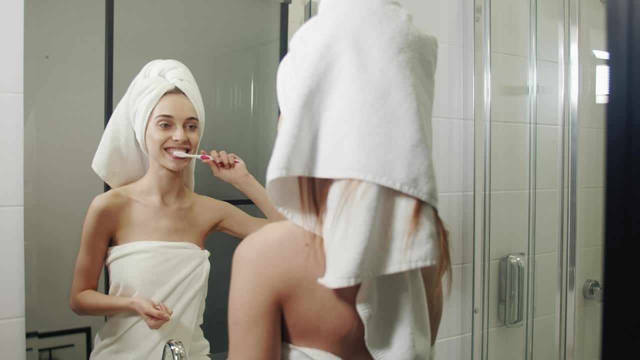 Stock Video Happy Woman Brushing Her Teeth In Her Morning Routine Animated Wallpaper - Free Download